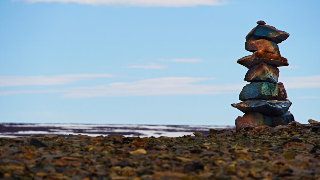 Artfully stacked rocks in Nunavut, Canada, forming a balanced composition that reflects the natural harmony of the surroundings and evokes the calming influence of Nunavut CBD Oil